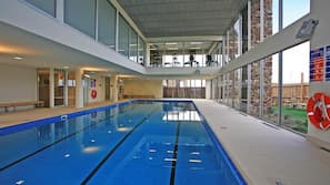 Indoor pool, outdoor pool, pool umbrellas, pool loungers