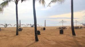 On the beach, white sand, free beach cabanas, sun-loungers