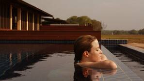 Outdoor pool, open 7 AM to 7 PM, pool loungers