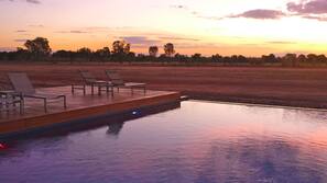 Outdoor pool, open 7 AM to 7 PM, pool loungers