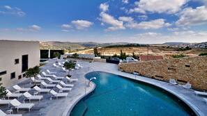 Indoor pool, outdoor pool, pool umbrellas, pool loungers