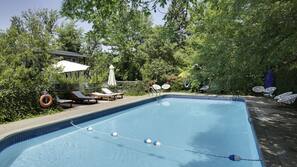 Seasonal outdoor pool, pool umbrellas, pool loungers