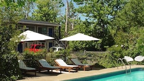 Seasonal outdoor pool, pool umbrellas, pool loungers