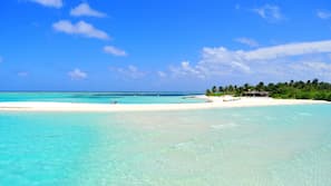 On the beach, white sand, beach towels, scuba diving