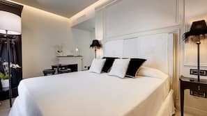 Luxe beddengoed, donzen dekbedden, een minibar, een kluis op de kamer