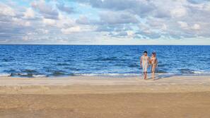 On the beach, white sand, beach volleyball, beach bar
