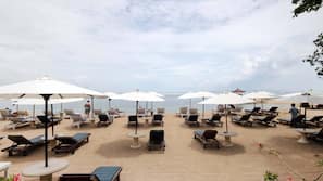 On the beach, sun-loungers, beach umbrellas