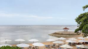 On the beach, sun-loungers, beach umbrellas