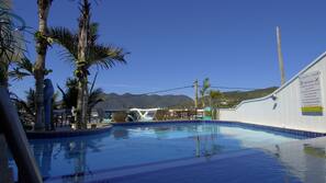 Outdoor pool, pool umbrellas, pool loungers