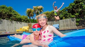 Seasonal outdoor pool, pool loungers