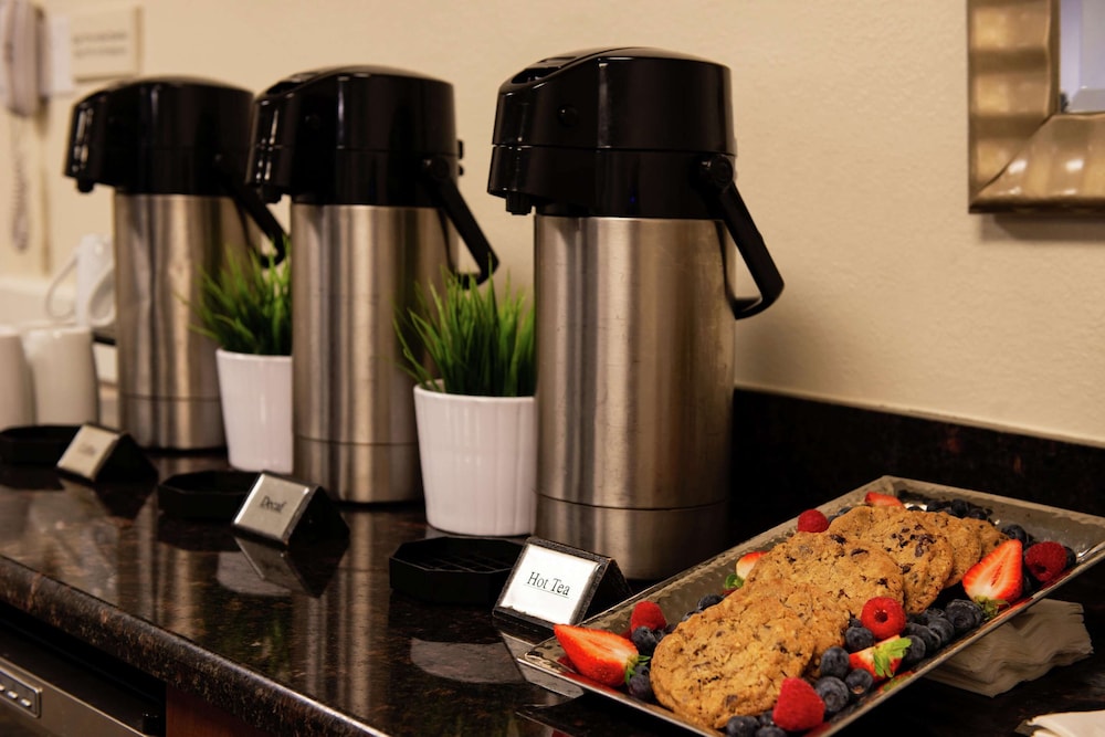 2 Connecting Suites with 3 beds and 1 sofabed at a Full Service Hotel by Suiteness