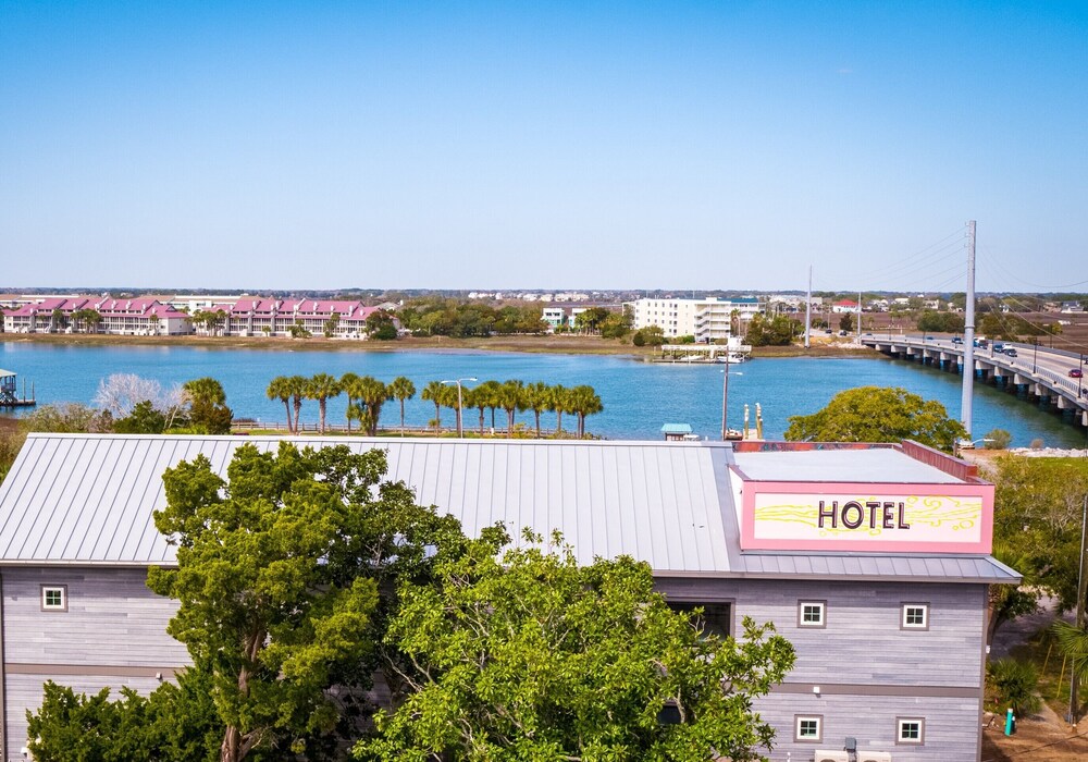 New boutique HOTEL FOLLY King Deluxe Studio 5 - cozy porch views of sunset over Folly River