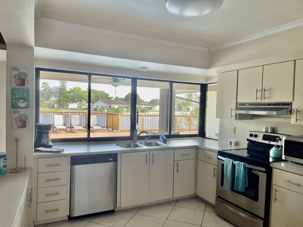 Sunny Dreams -- Your spacious waterfront pool home with a deck