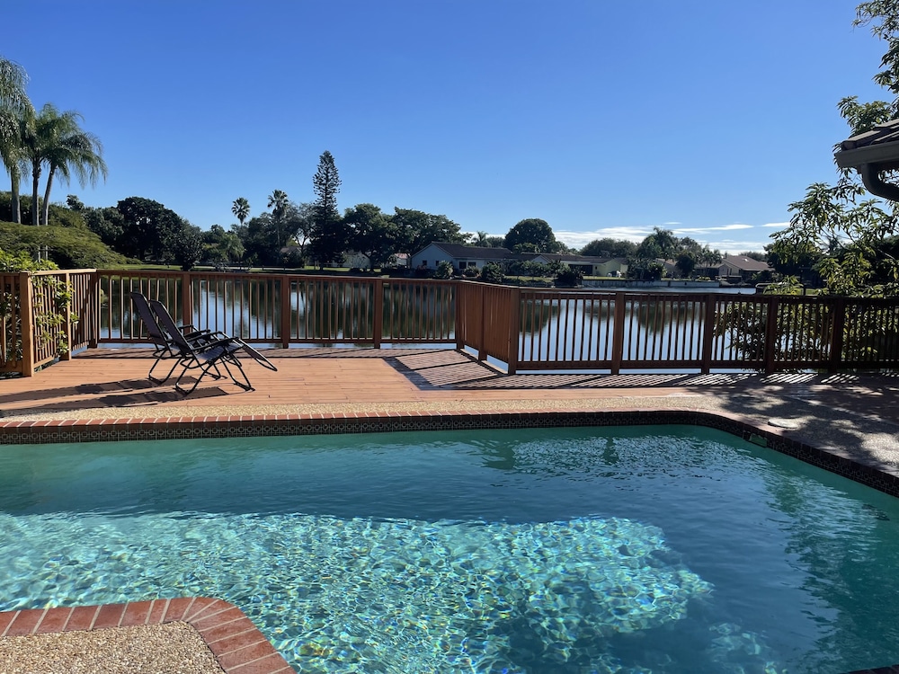 Sunny Dreams -- Your spacious waterfront pool home with a deck