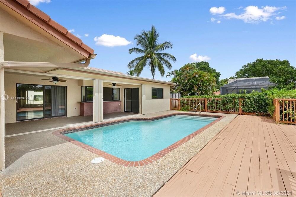 Sunny Dreams -- Your spacious waterfront pool home with a deck