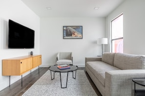 Deluxe Apartment, 1 Bedroom | Living area | 55-inch flat-screen TV with digital channels, TV, streaming services