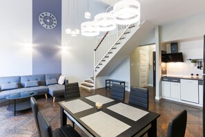 Family Apartment | Living area | 40-inch flat-screen TV with cable channels, TV