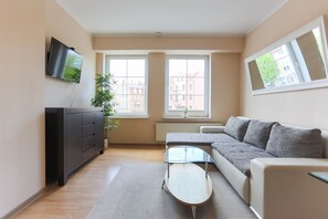 Standard Apartment | Living area | 40-inch flat-screen TV with cable channels, TV