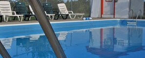 Seasonal outdoor pool, open 10:00 AM to 8:00 PM, sun loungers