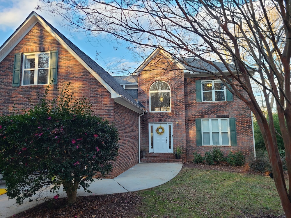 NEW LISTING! Lake Front 5 bedroom with Private Dock and Two Car Garage