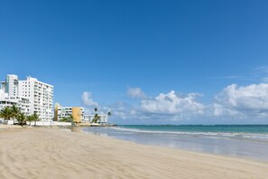 Beach nearby, white sand, sun loungers, beach umbrellas