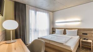 Luxe beddengoed, pillowtop-bedden, een kluis op de kamer, een bureau