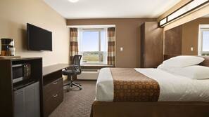 Premium bedding, desk, laptop workspace, blackout drapes