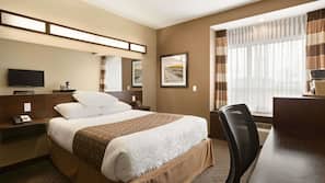 Premium bedding, desk, laptop workspace, blackout drapes