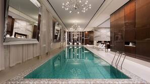 Indoor pool, open 6:00 AM to 10:00 PM, pool loungers