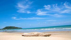 On the beach, sun-loungers, beach umbrellas, beach towels