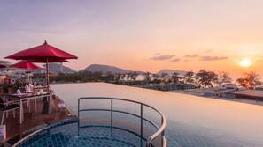 Outdoor pool, open 7 AM to 9 PM, free pool cabanas, pool umbrellas