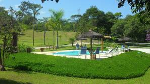 Outdoor pool, pool umbrellas, sun loungers