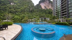 Outdoor pool, open 7:00 AM to 10:00 PM, pool loungers