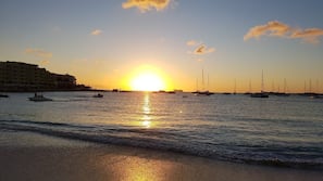 Beach nearby, white sand, beach towels