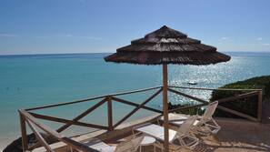 Private beach, white sand, sun loungers, beach umbrellas