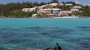 Private beach, white sand, sun loungers, beach umbrellas
