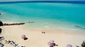 Private beach, white sand, sun loungers, beach umbrellas