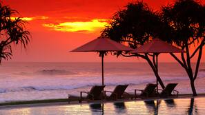 Indoor pool, outdoor pool, pool umbrellas, pool loungers