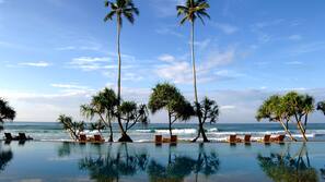 Indoor pool, outdoor pool, pool umbrellas, pool loungers