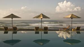Indoor pool, outdoor pool, pool umbrellas, pool loungers