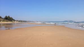 On the beach, sun loungers, beach umbrellas