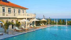 Outdoor pool, pool umbrellas, sun loungers