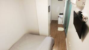 Blackout curtains, iron/ironing board, free WiFi, linens