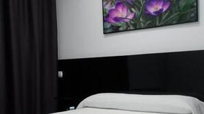Caja fuerte, escritorio, cortinas opacas y wifi gratis