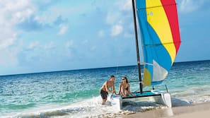 Private beach, white sand, sun loungers, beach umbrellas
