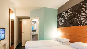 Premium bedding, desk, laptop workspace, blackout drapes