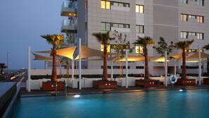 Indoor pool, outdoor pool, pool umbrellas, pool loungers