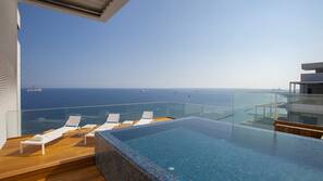Indoor pool, outdoor pool, pool umbrellas, pool loungers