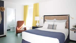 Premium bedding, down comforters, blackout drapes, iron/ironing board