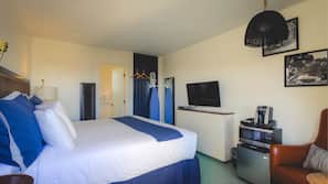 Premium bedding, down comforters, blackout drapes, iron/ironing board